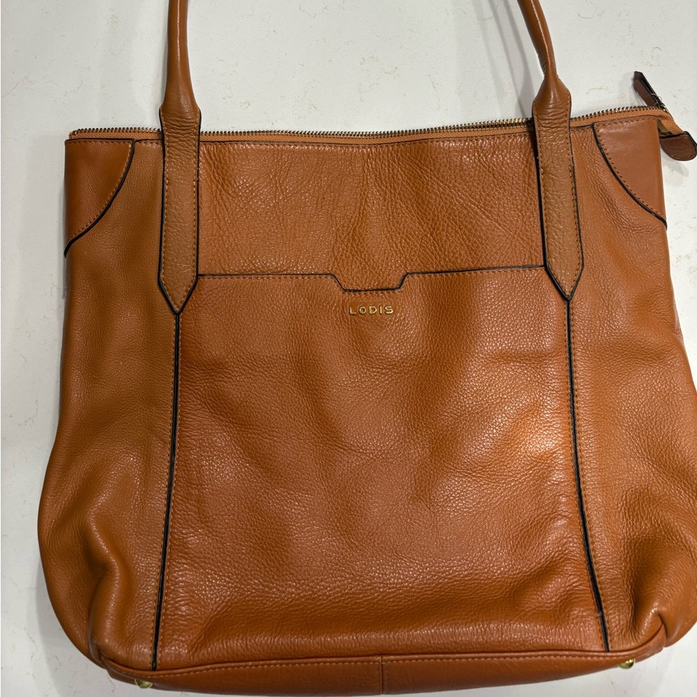 Lodis Brown Leather Purse Unzip the outside bottom to slide over luggage handle